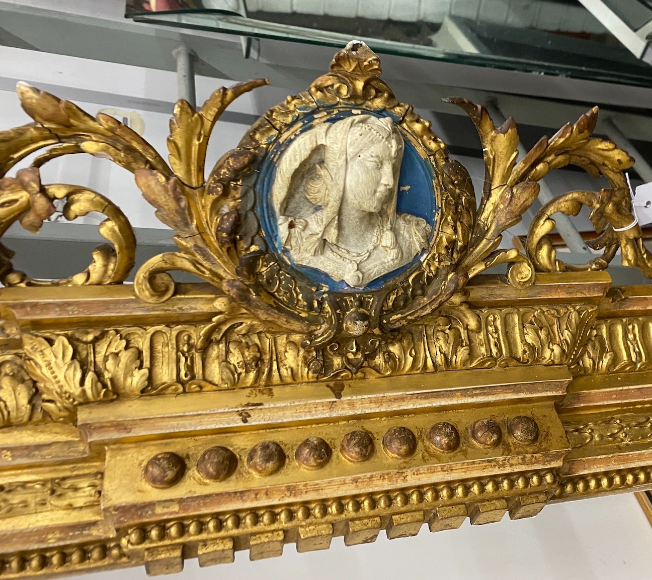 A Victorian carved giltwood and composition pediment with faux jasper panels, length 280cm